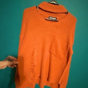 Long sleeve distressed sweater.